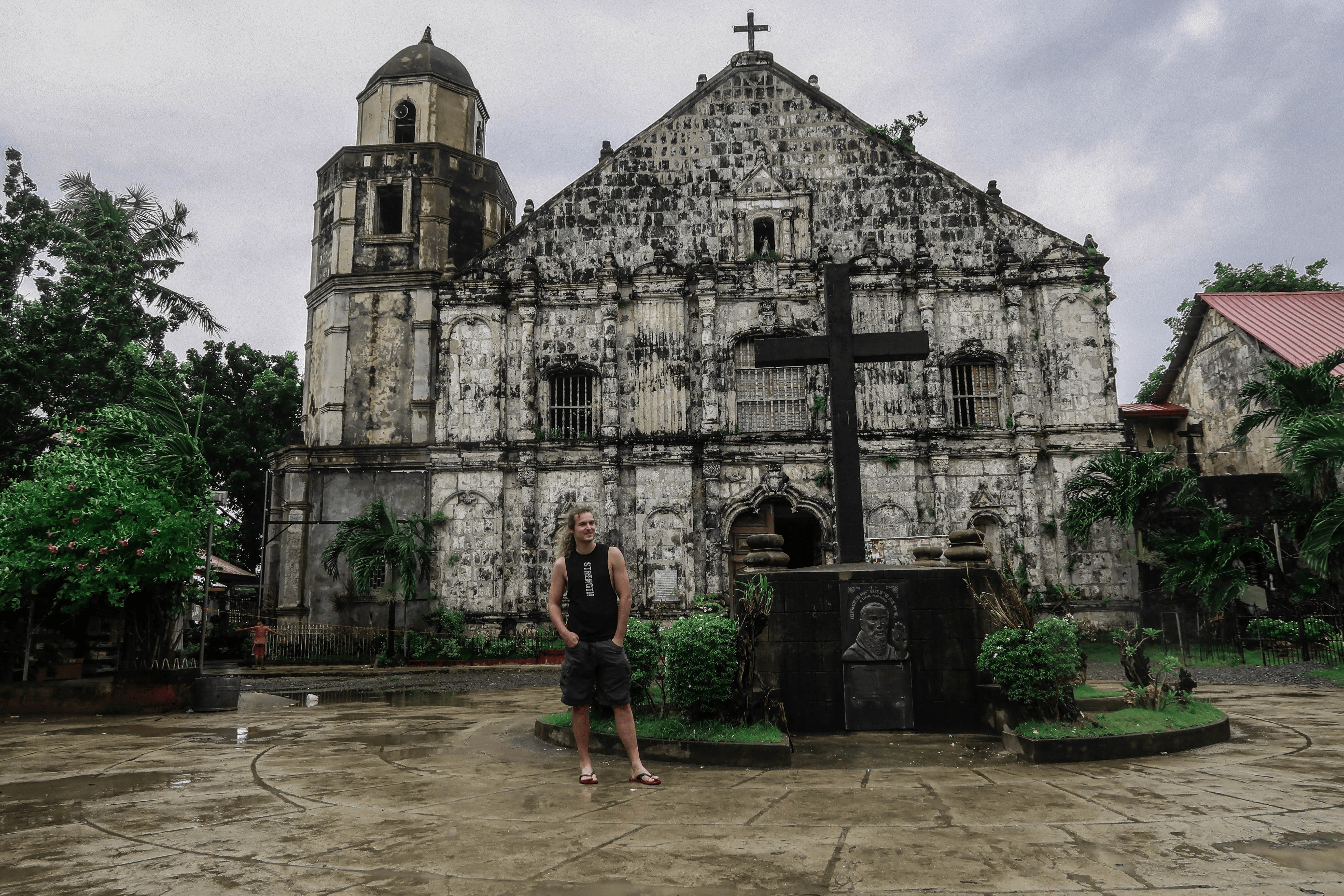lenny through paradise in front of the old church of bolinao in pangasinan philippines